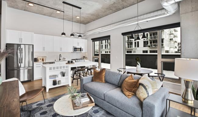 Find your perfect fit at Odin a living room with a couch and a table