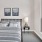 a bedroom with a bed and lamps