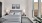 a bedroom with a bed and lamps