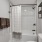 a bathroom with a shower and toilet