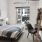 a bedroom with a bed and a chair