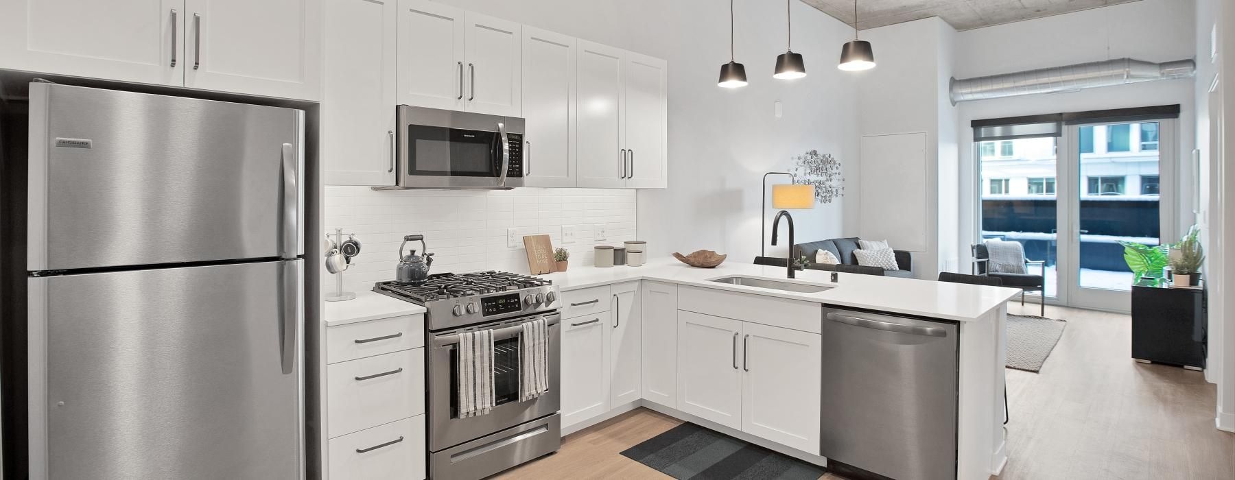 a kitchen with white cabinets
