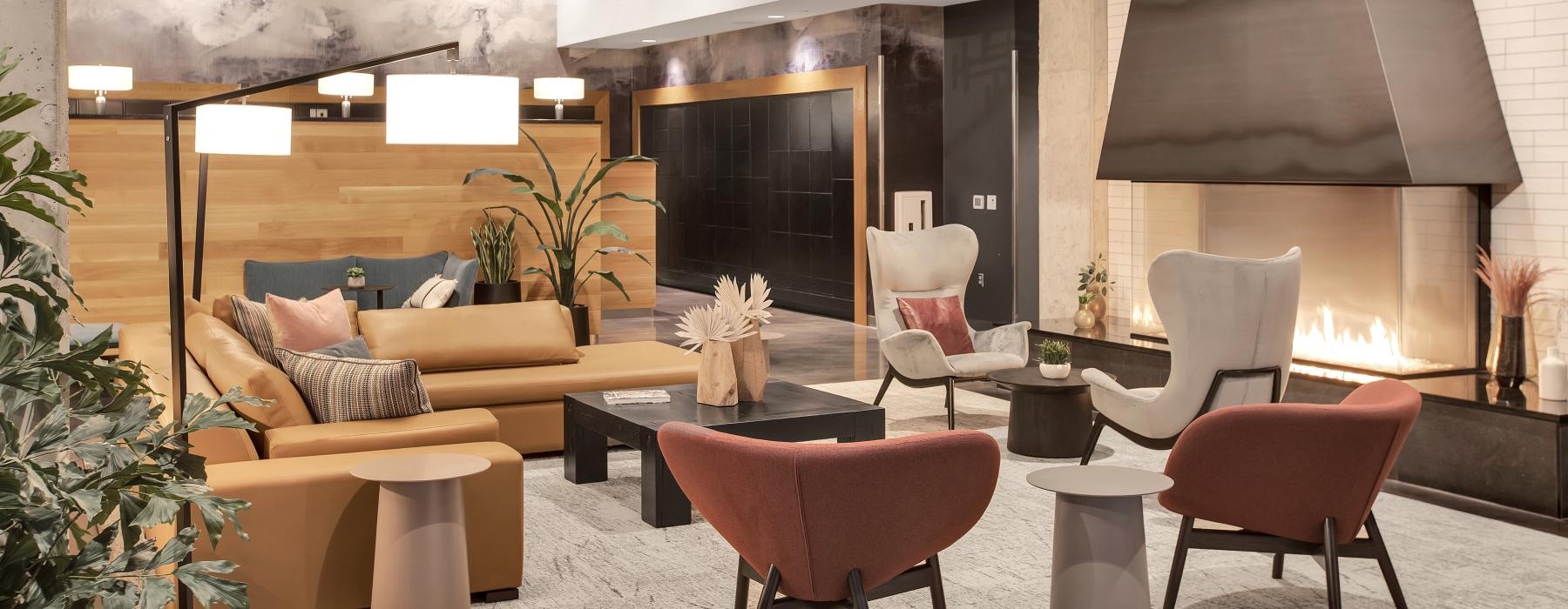 a room with a fireplace and chairs