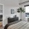 a bedroom with a bed and a plant