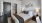 a bedroom with a bed and lamps